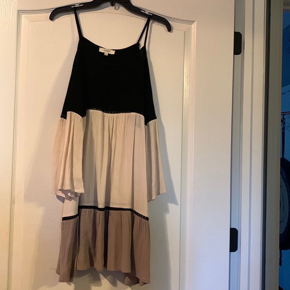 Large black cream and tan cold shoulder top